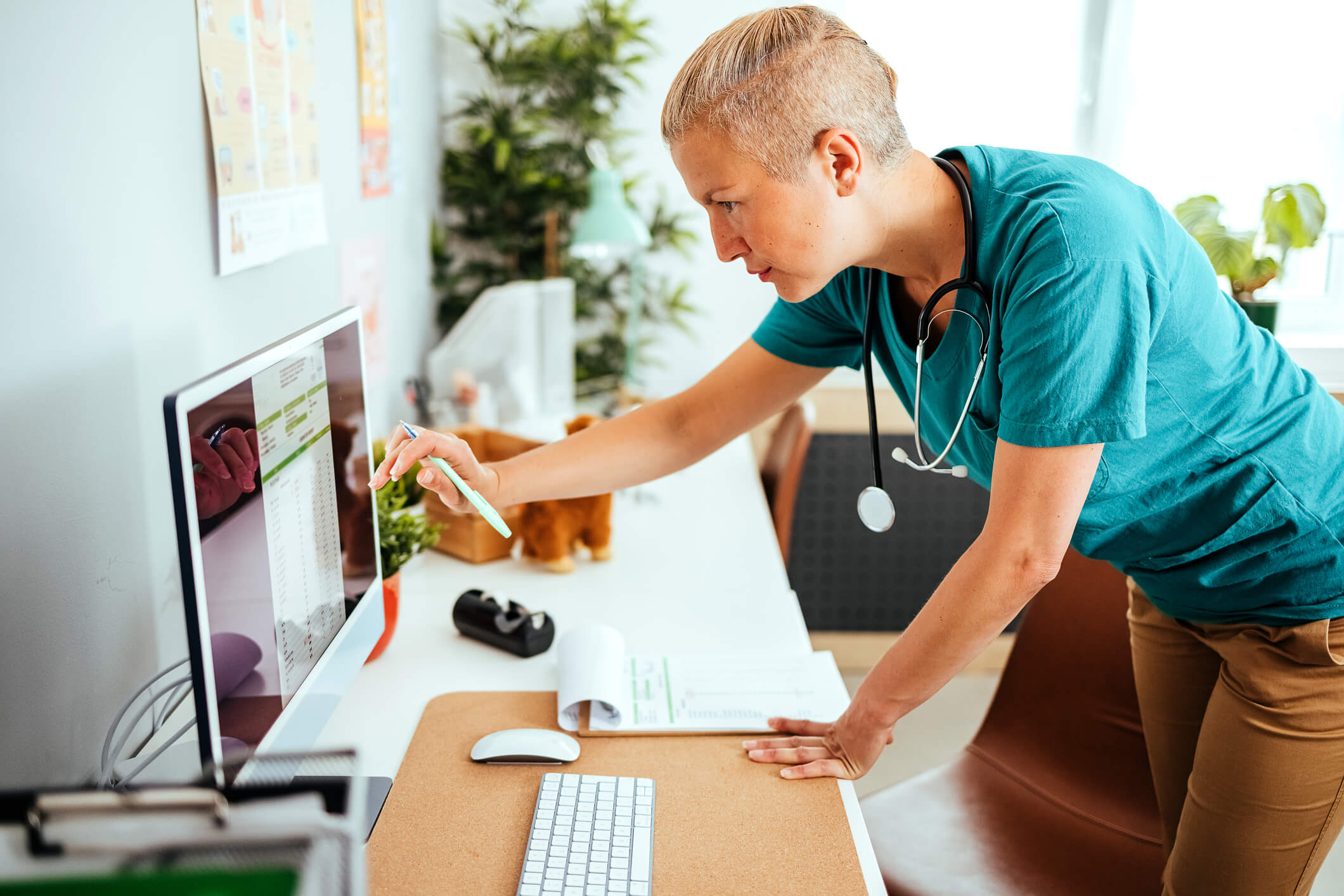 a women veterinarian looking over her trademarks and intellectual property on the computer