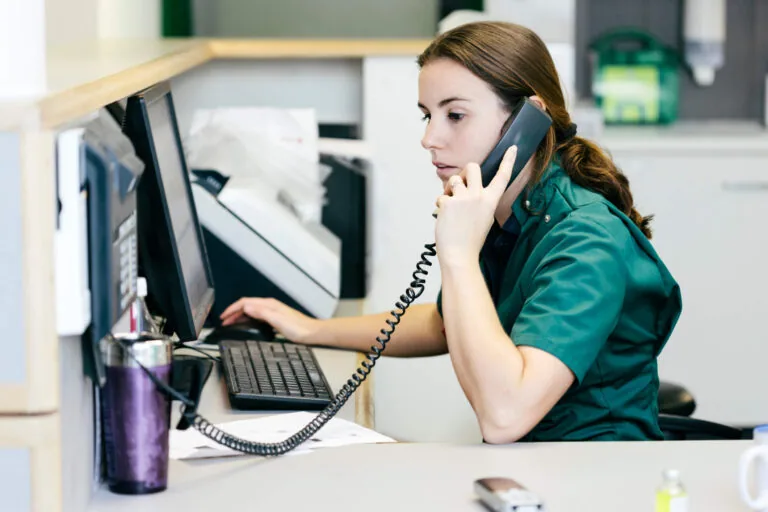 Veterinarian discussing selling their practice on the phone.