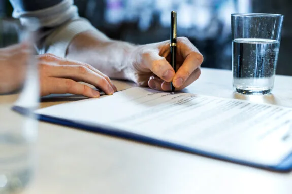 veterinary practice owner signing legal documents